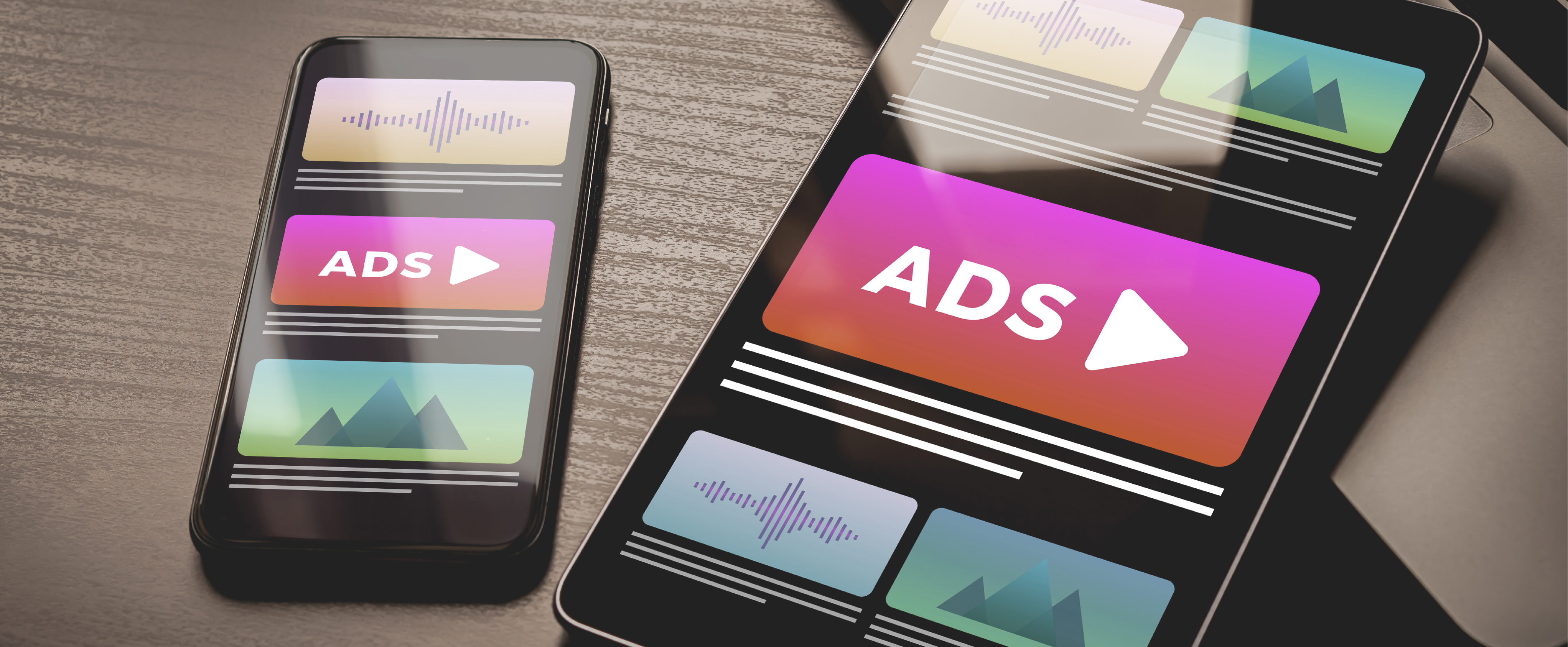 Ipad_and_iPhone_put_together_with_ads_example_displayed_on_screen.png